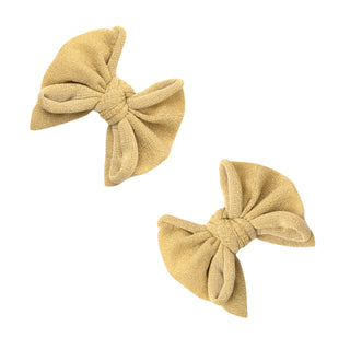 Gold metallic baby DEB clip set by Baby Bling, featuring shiny clips designed for baby accessories and hair styling.