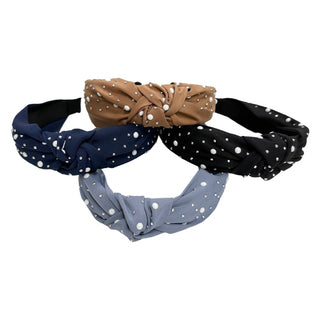 Basically Bows & Bowties stud and pearl knot headband with fabric knots and decorative pearl accents, styled on a head.