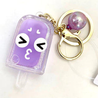 BCMINI ice pop face emoji charm keyring with colorful ice pop design and playful facial expression on a keychain.