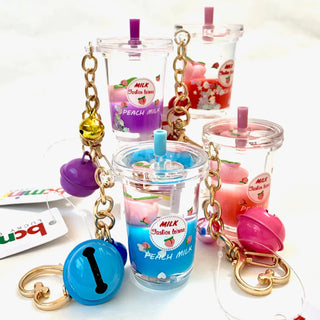 BCMINI Peach Milk Bell charm keychain with cute peach design and bell, perfect as a decorative accessory or keyring.