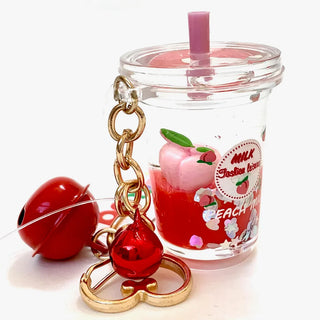 BCMINI Peach Milk Bell Charm Keyring with cute peach and milk-themed design, featuring a small bell and colorful accents.