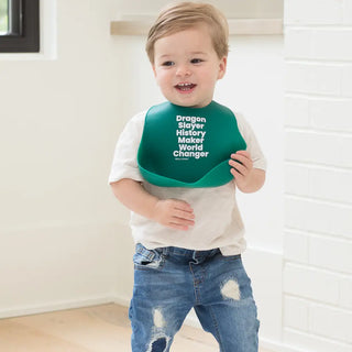 Bella Tunno Dragon Slayer Wonder Bib showing a colorful, adjustable baby bib with playful dragon design and soft fabric for mealtime.