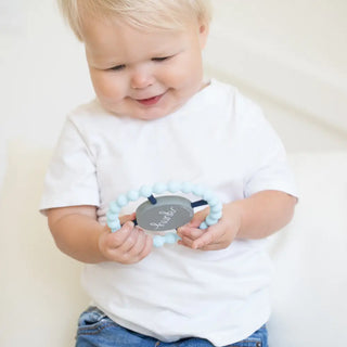 Bella Tunno Hunk Happy Teether, soft silicone teething toy with colorful design and textured surface for soothing babies.
