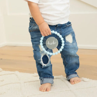 Bella Tunno Hunk Happy Teether for babies, soft silicone teether with colorful design and textured surface for soothing gums.