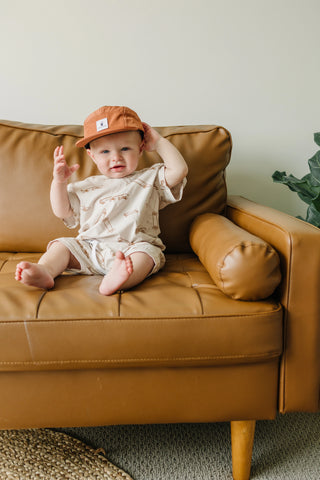 Cash & Co toasted coconut hat, small size for ages 6 months to 2 years, featuring a cozy, textured knit design.