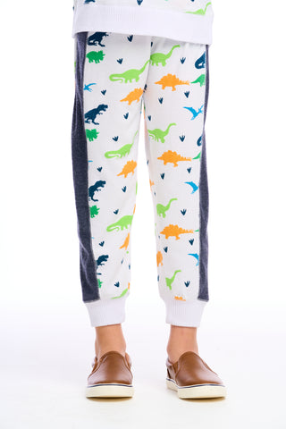 Chaser Dino Jogger pants in white with dinosaur print, featuring a relaxed fit and elastic waistband for comfortable casual wear.