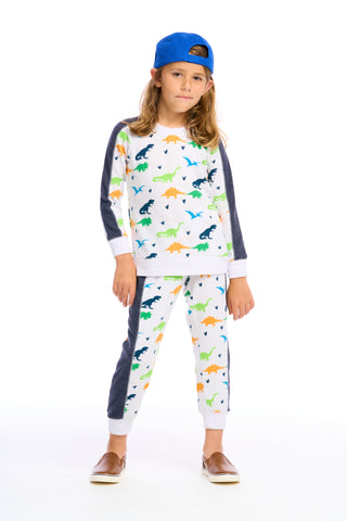 Chaser Dino Jogger pants in white with dinosaur print, featuring elastic waistband and relaxed fit for casual wear.