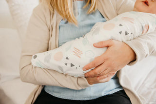 Copper Pearl Bayside Knit Swaddle Blanket showing soft, blue and white knit fabric perfect for swaddling a baby.