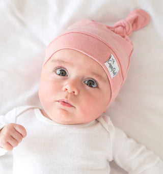 Copper Pearl Darling Top Knot Hat in soft fabric with a stylish top knot design, perfect for babies or toddlers.