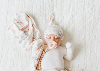 Copper Pearl Enchanted Top Knot Hat in soft fabric with a playful top knot, perfect for babies and toddlers.