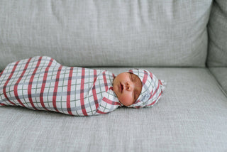 Copper Pearl Jolly Top Knot Hat in soft fabric, featuring a cute top knot design, perfect for babies.