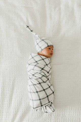 Copper Pearl Ledger Top Knot Hat, a soft, stylish baby hat with a knot detail, made by Copper Pearl for comfortable wear.