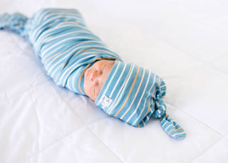 Copper Pearl Milo top knot hat featuring soft, cozy fabric and a stylish knot design for babies and toddlers.