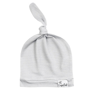Copper Pearl Taylor top knot hat in copper color, featuring a soft, cozy design for infants and young children.