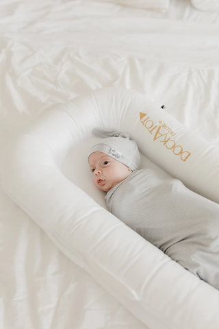 Copper Pearl Taylor top knot hat in soft, cozy fabric with a stylish knot detail for babies and toddlers.