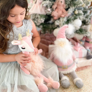 Pink Reindeer stuffed animal doll from Mon Ami, featuring soft plush fabric and detailed reindeer face with pink accents.
