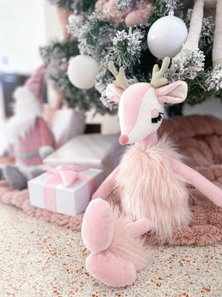 Pink plush Reindeer doll named Freija by Mon Ami, soft stuffed animal with detailed antlers and cozy fabric.