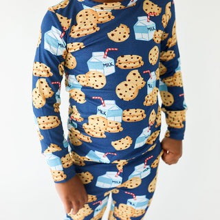 Pink and white milk and cookies print pajama set for toddlers, long-sleeve basic loungewear by Posh Peanut, suitable for 12-18 months.
