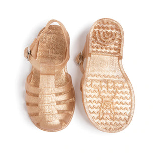 Shooshoos Cali Jelly Sandal in gold glitter with open toe and strap design, perfect for stylish young children.
